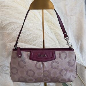 Coach beige w/ rasberty trim 9 1/2by 5 1/2, 8 card slots, side pocket handbag!